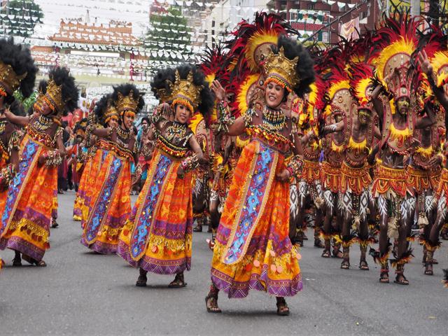 TRIBAL PEOPLE PARADING ON DINAGYANG FESTIVAL