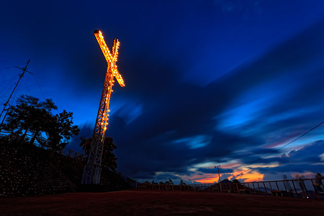 A sunrise shot of the cross in the summit of Mt Tapyas during the blue hour